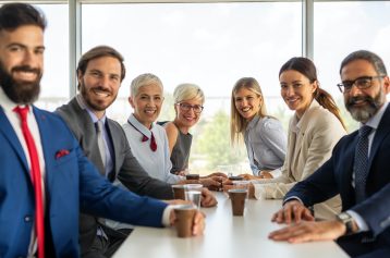 portrait-of-successful-business-team-posing-in-office.jpg